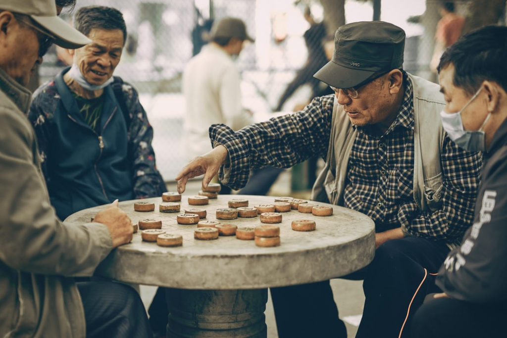 senior citizen playing chinese chess